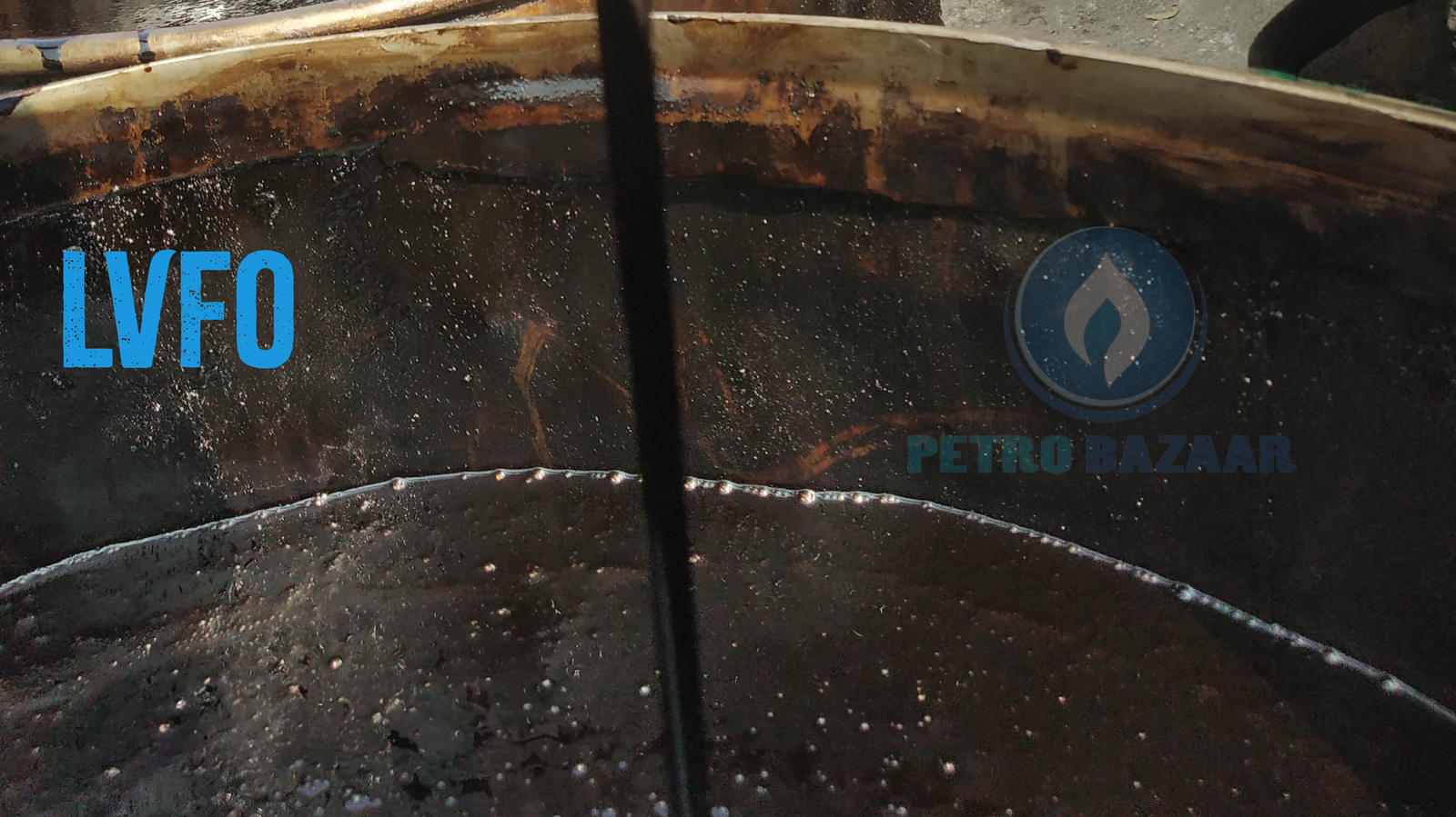 Image shows low viscosity fuel oil (lvfo) flowing from tanker into barrel. Lvfo is a low viscosity graded furnace oil used for boiler firing.