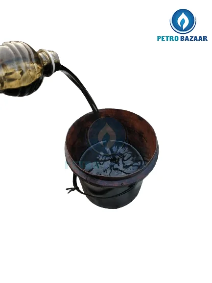 image shows tyre oil pouring into bucket