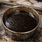 image shows that used oil is filled into a vessel.